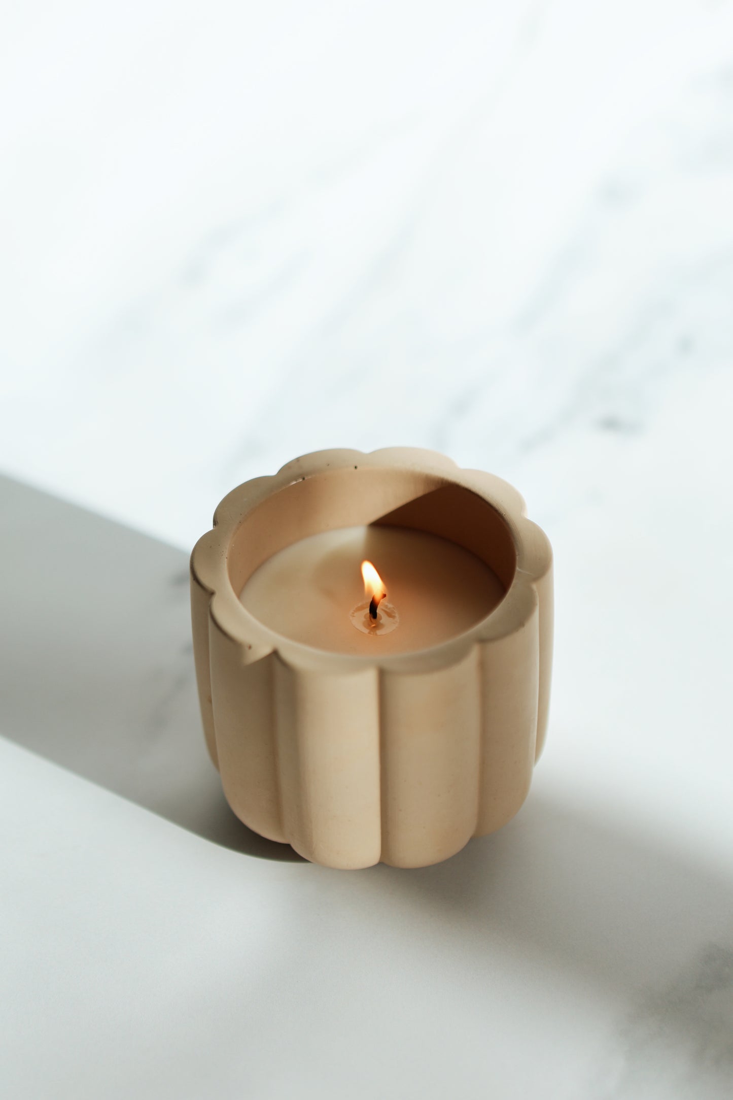cement scalloped candle